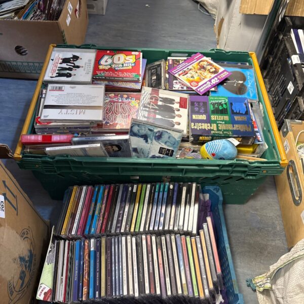 Mixed music CD lot in a plastic crate, variety of albums.