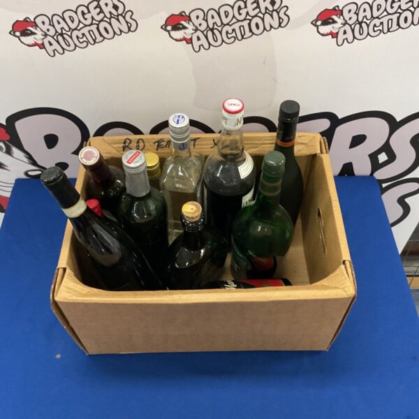 Mixed assortment of vintage glass spirit and wine bottles.