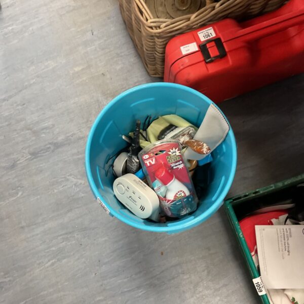 Mixed supplies lot with paint brushes and a smoke alarm visible.