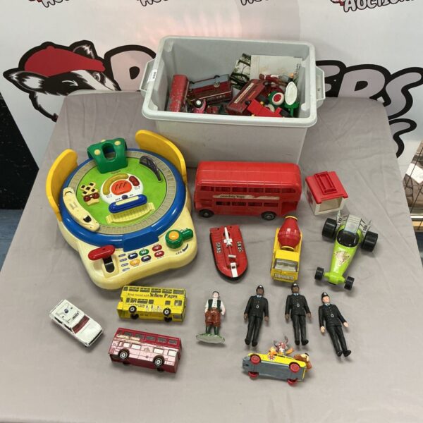Mixed toy lot featuring diecast cars and vintage toys.
