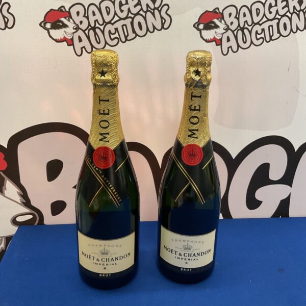 Two sealed bottles of Moët & Chandon Imperial Brut Champagne for auction.