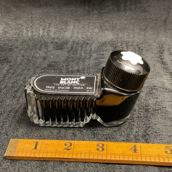 Vintage Montblanc ink bottle with black ink.