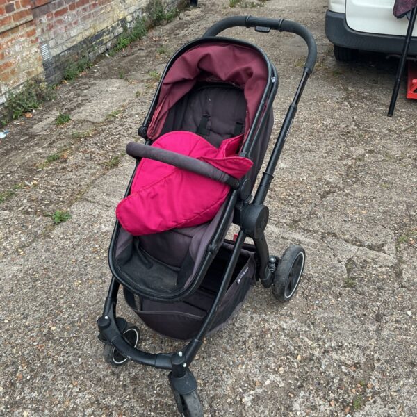 Burgundy Mothercare Journey pushchair with pink footmuff.