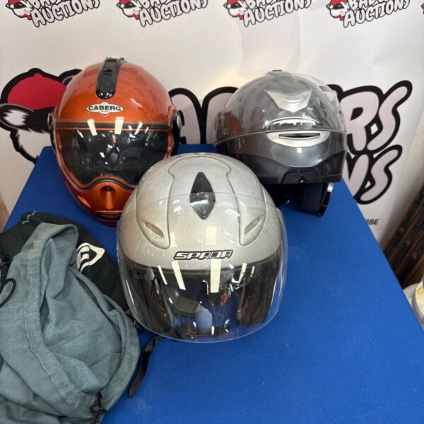 Motorcycle helmet lot including HJC, Spada, and Caberg brands.