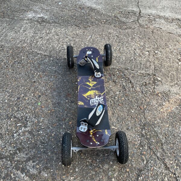 Used mountain board with pneumatic tires for off-road adventures.