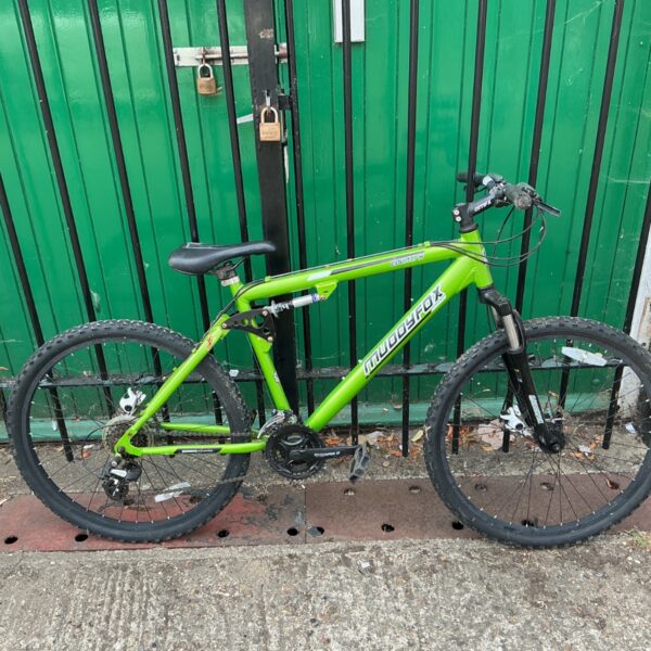 Vibrant green Muddyfox Country mountain bike with full suspension.