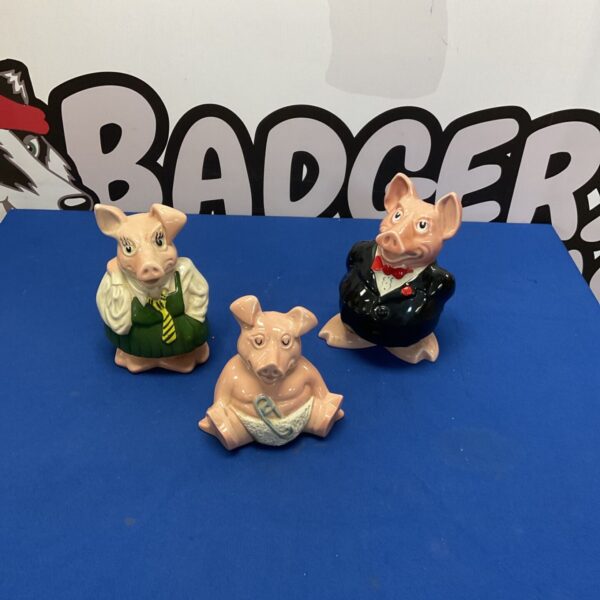 Group of three vintage Natwest Pottery pigs, collectible ceramic piggy banks.