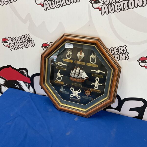 Vintage nautical knot display with Mayflower ship in octagonal frame.