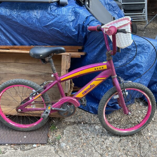 Purple and yellow Neon Cosmic child’s bicycle, vintage 1980s style.