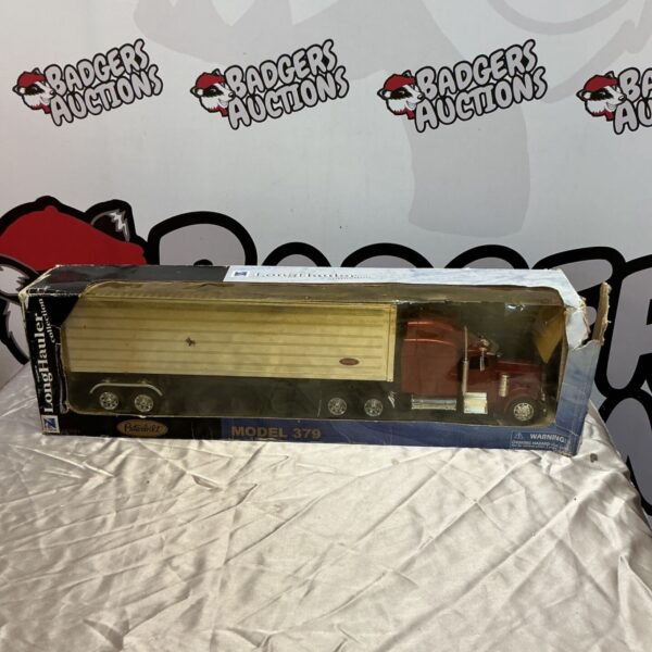 NewRay Long Hauler Collection Model 379 diecast semi-truck in packaging.