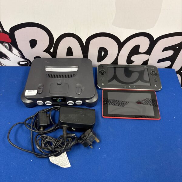 Nintendo N64 console with two controllers, retro gaming system.