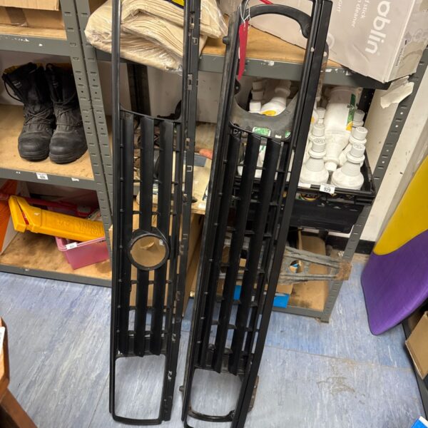 Pair of black metal front grilles for Nissan Patrol and VW Jetta.