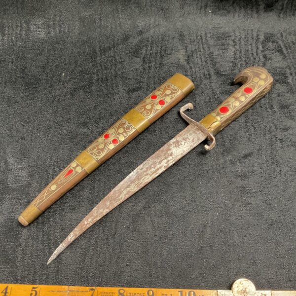 Mid-century North African dagger with detailed wooden scabbard.