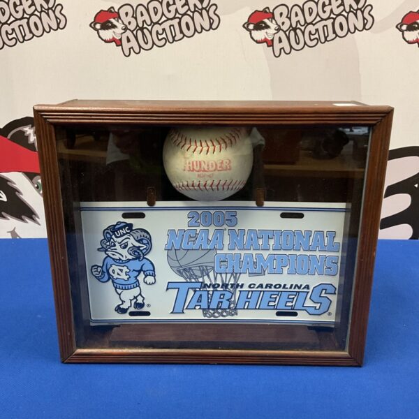 North Carolina Tar Heels 2005 championship display case with baseball.