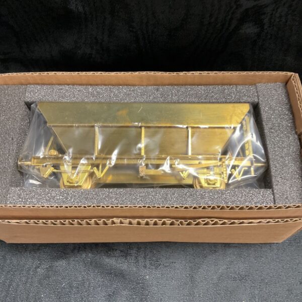 Detailed unpainted brass O gauge articulated hopper for model railways.
