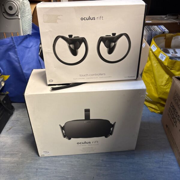 Oculus Rift VR headset with touch controllers in original packaging.