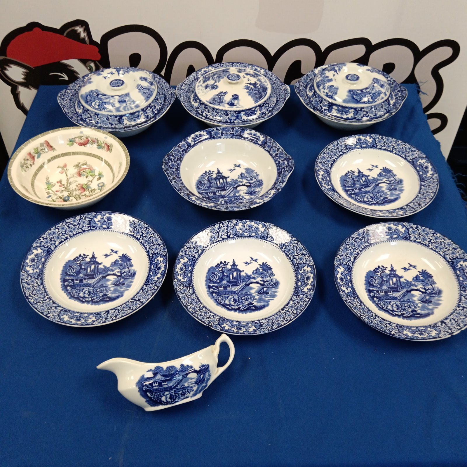 Vintage Old Alton Ware blue and white bowls and tureens displayed.