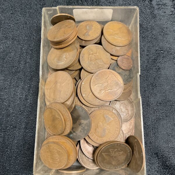 A kilogram of old British pennies in a plastic container.