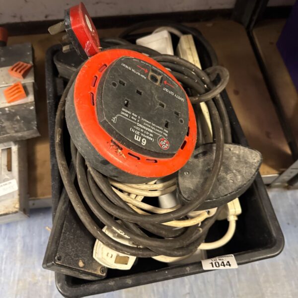 Orange extension lead reel with cable wound inside.