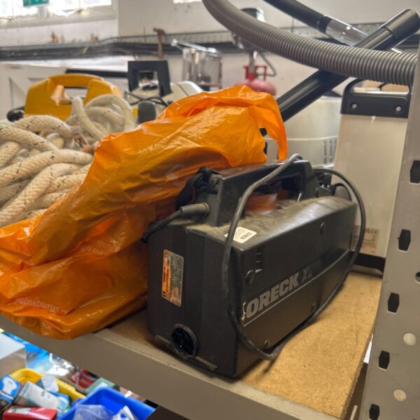 Oreck XL handheld vacuum cleaner with attachments and bags.