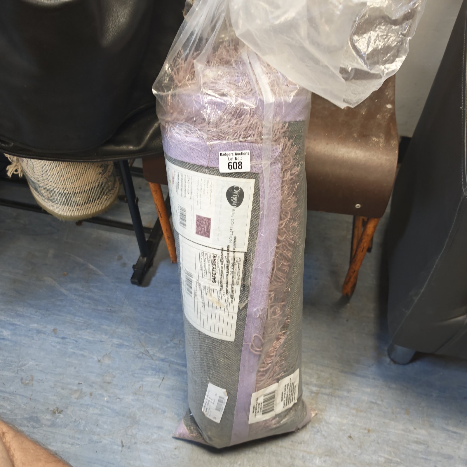 Sealed Origin Rug Collection rug in plastic packaging.