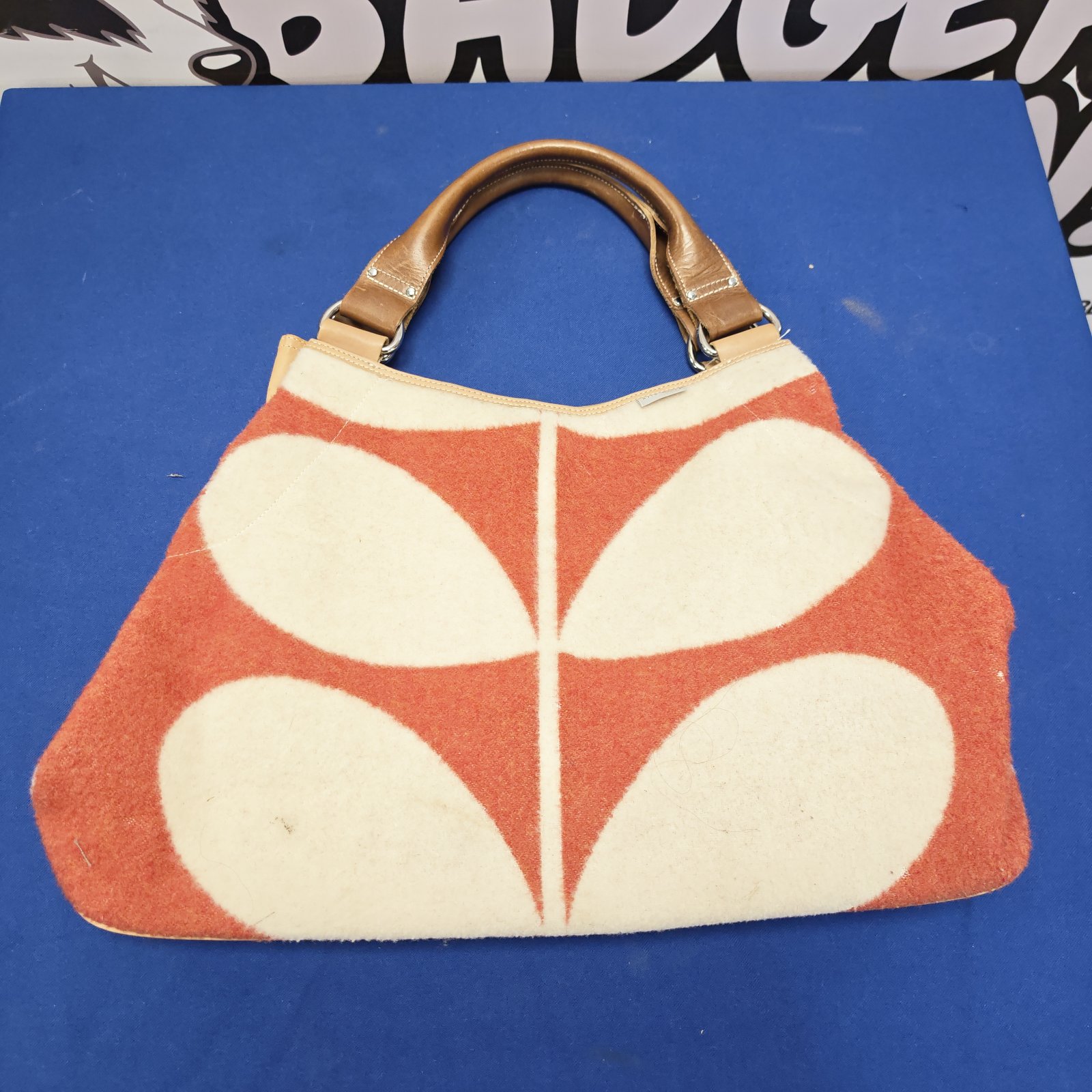 Orla Kiely handbag with a bold floral pattern.