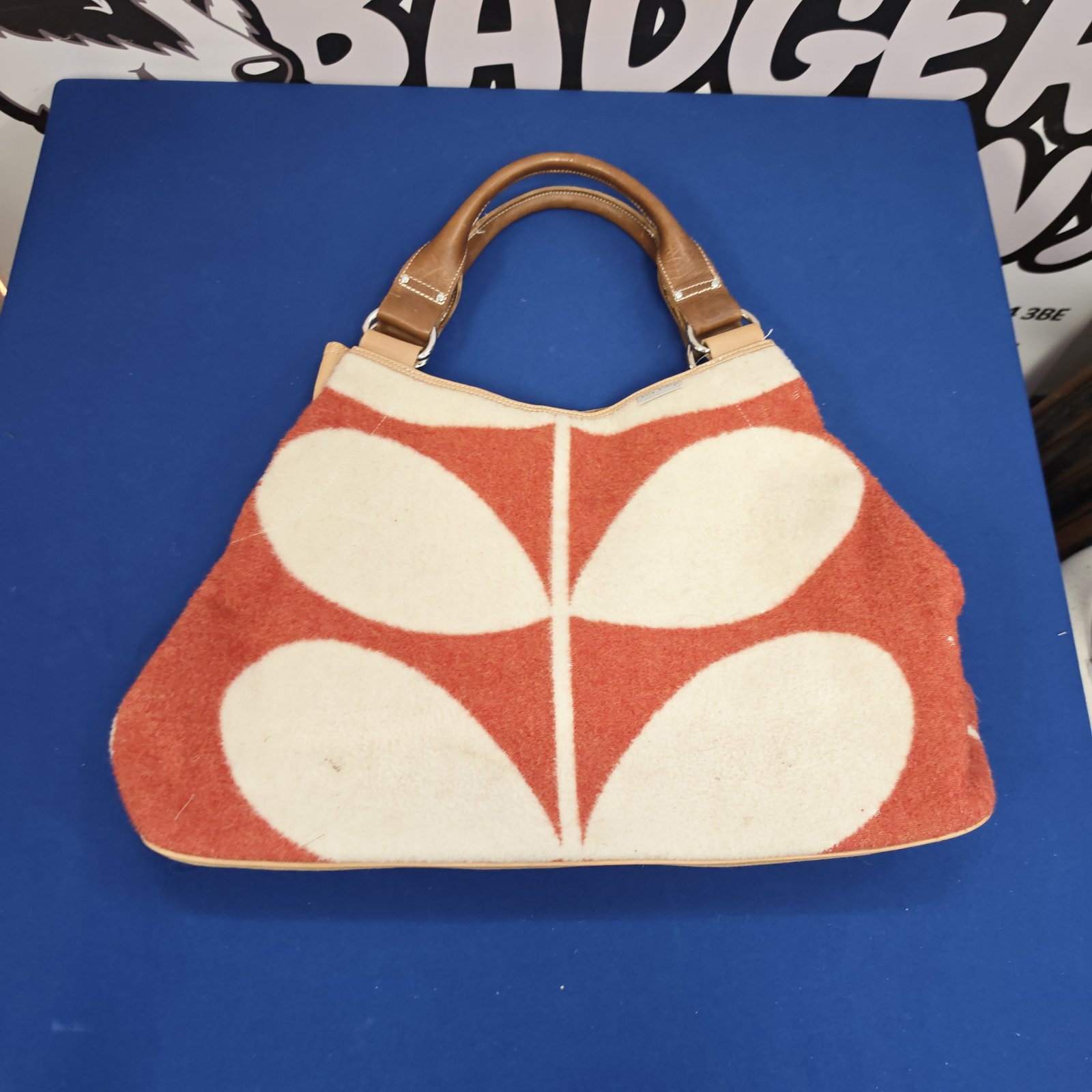 Orla Kiely style floral handbag with a patterned front panel.
