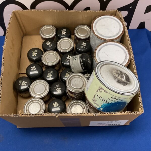 Collection of colourful paint tins and tester pots.