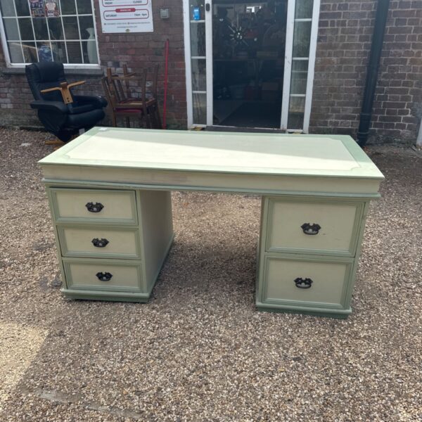 Vintage painted wooden desk with drawers and iron handles.