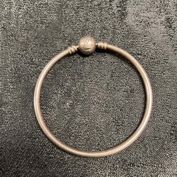 Silver Pandora bangle bracelet, ideal for charm additions.