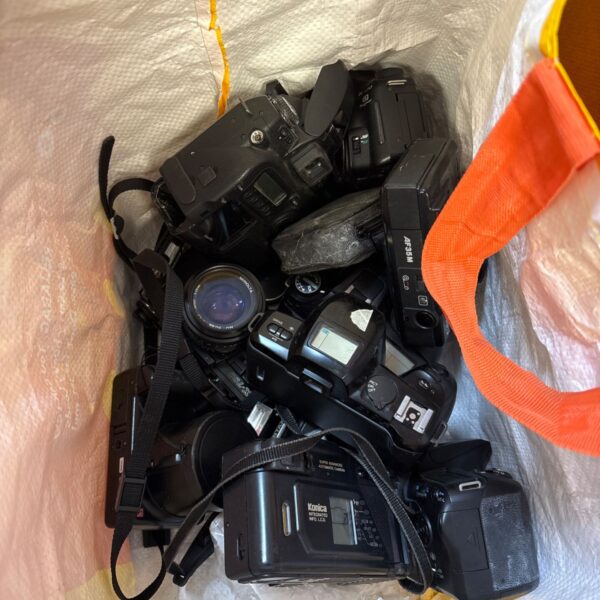 Pentax camera lot including a K1000 in a camera bag.
