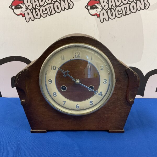 Vintage Perivale Andrews mantle clock with art deco design.