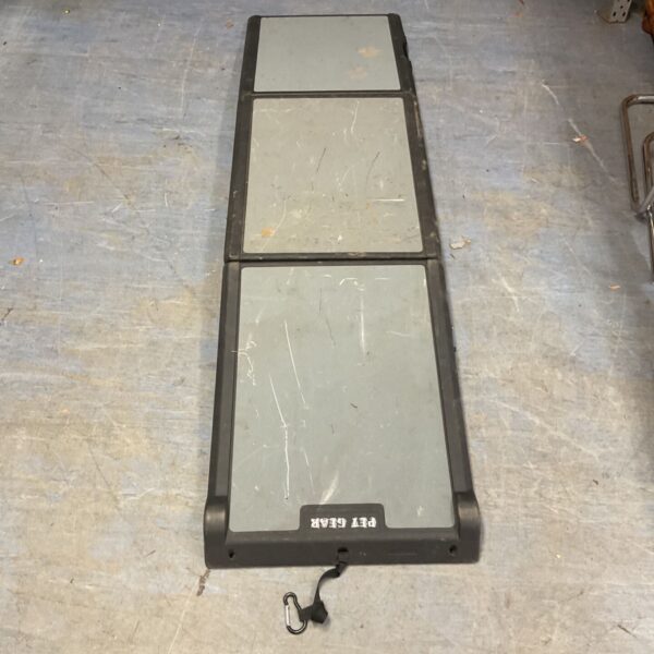 Portable pet ramp with textured grip for easy pet access.