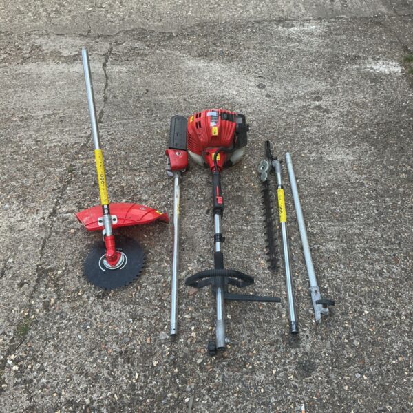 Petrol multi-tool garden power unit with attachments for various tasks.