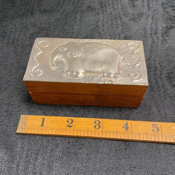 Vintage pewter trinket box with elephant lid, collectible animal decor.
