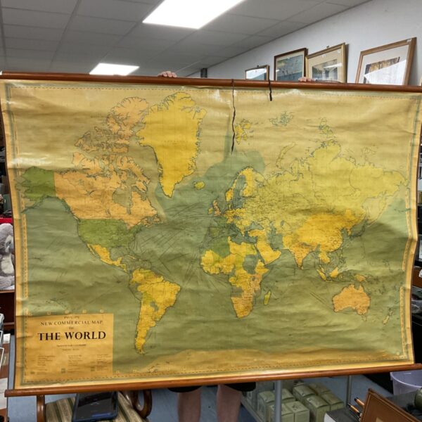 Large vintage Phillips school map of the world displayed indoors.