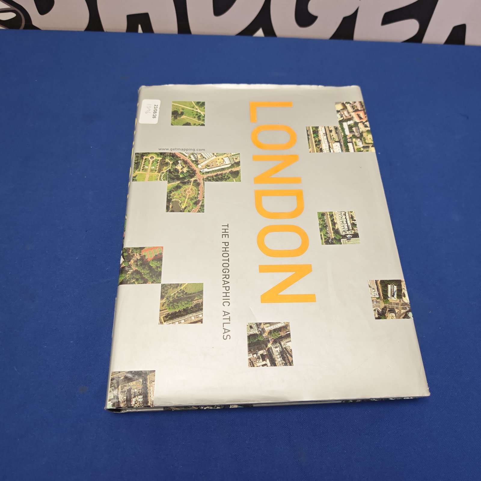 Vintage photographic atlas of London book cover.