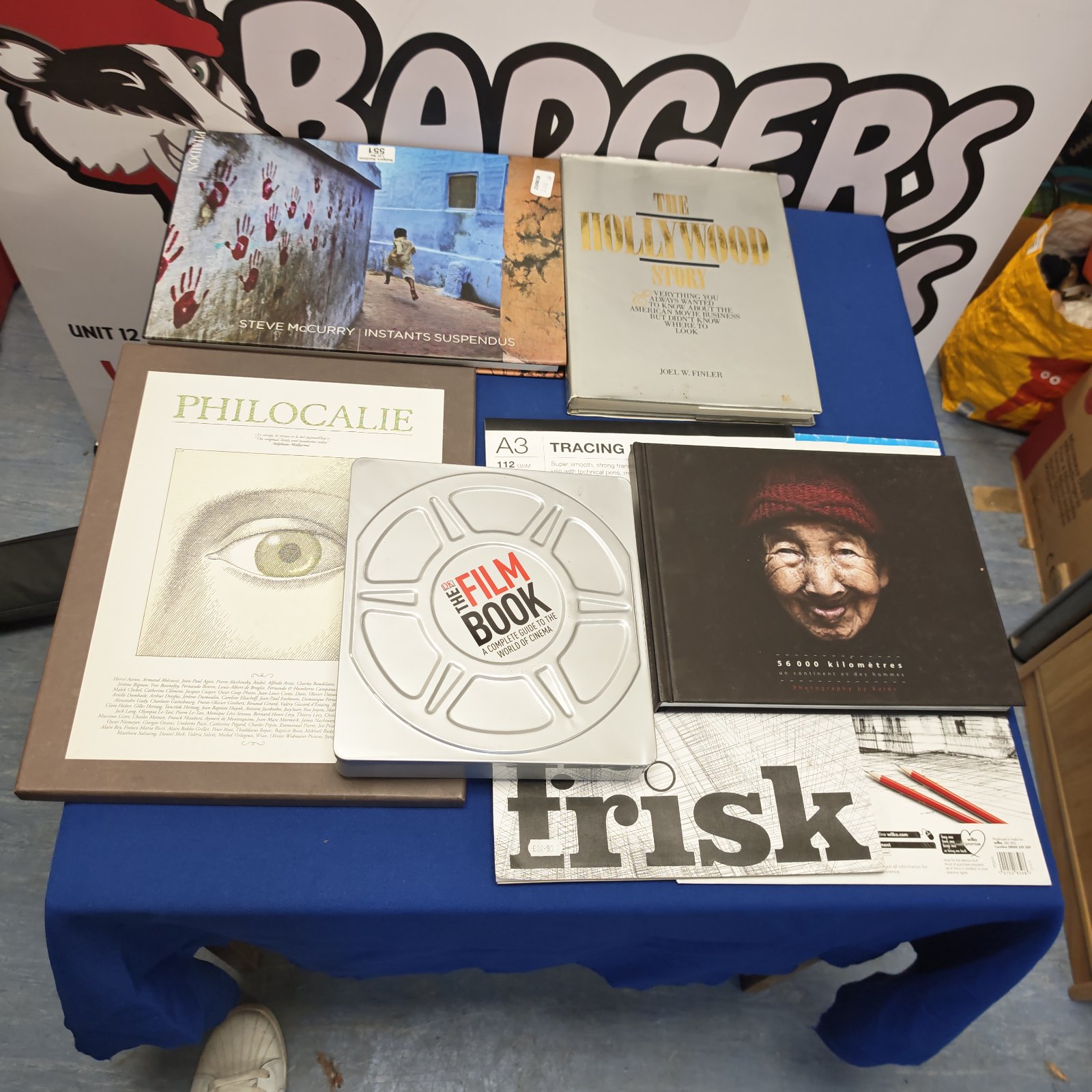 Photography and film book collection including Steve McCurry title.