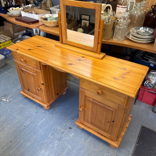 Vintage pine desk with mirror, front view.