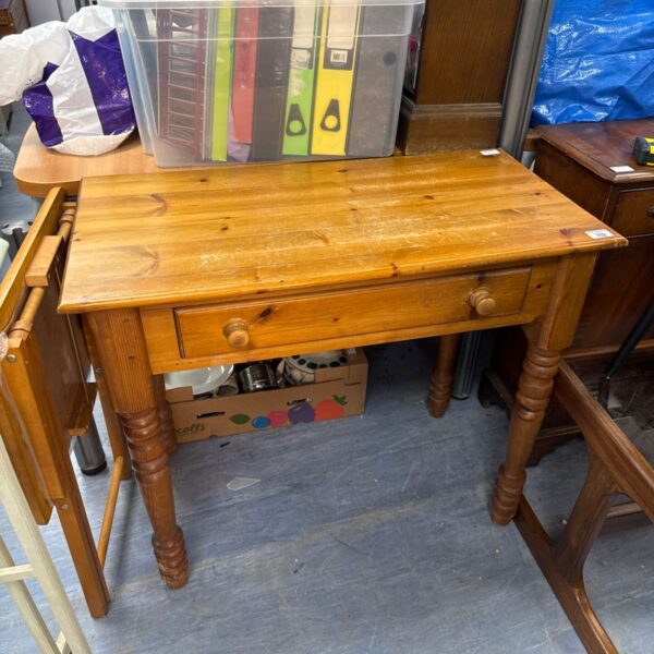 Rustic pine hall table with a single drawer, ideal for entryways.