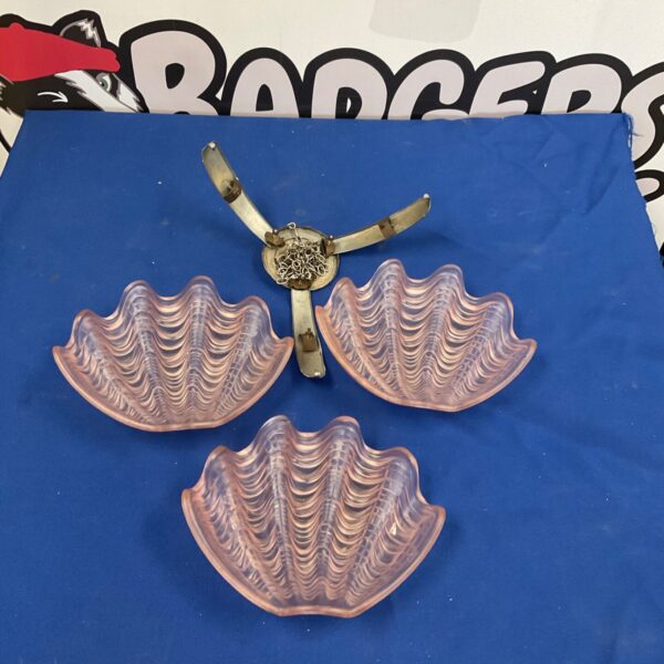 Vintage pink glass ceiling light shade with scalloped edges.