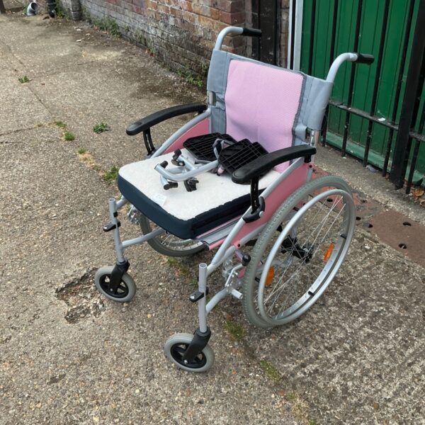 Pink I-Go Candi self propelled manual wheelchair for mobility.