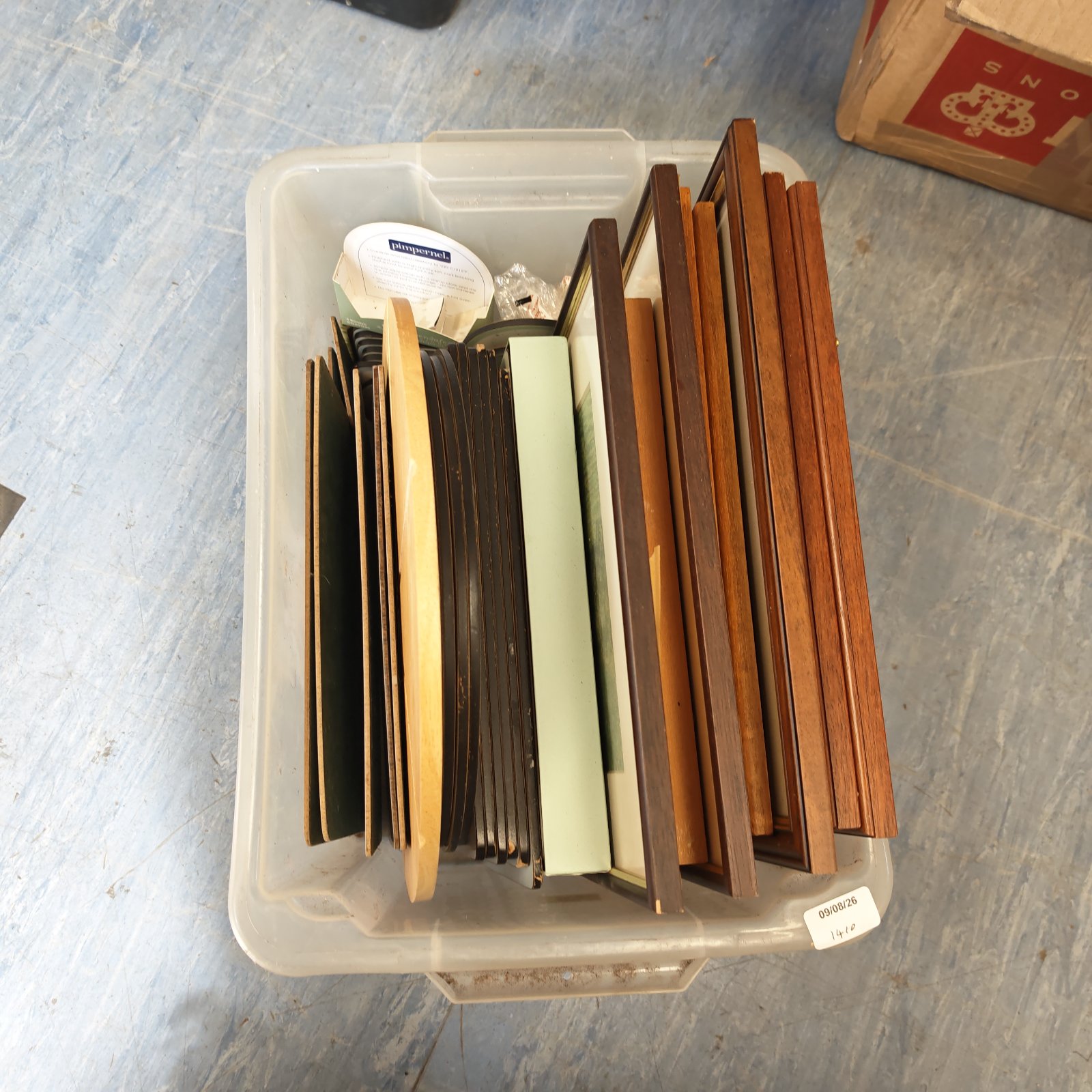Mixed lot of vintage place mats and picture frames for home decor.