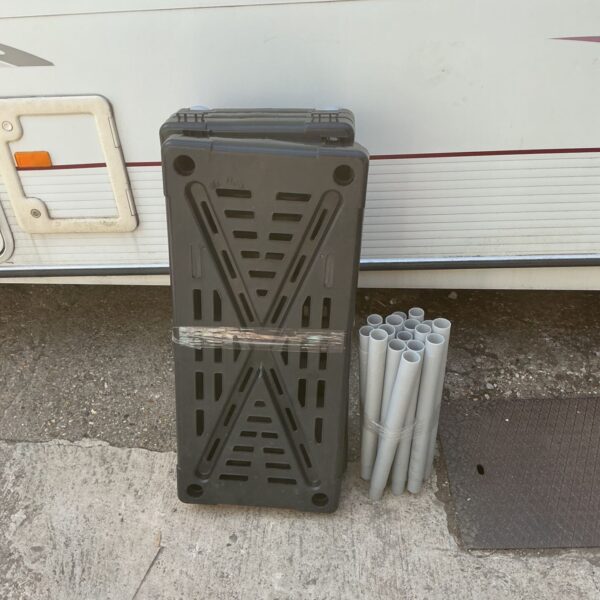 Used plastic shelving unit for garage or utility room storage.