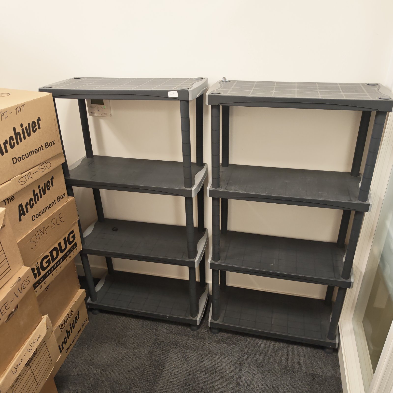 Two tier plastic storage shelving unit for home organization.
