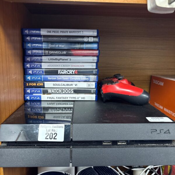 Sony PlayStation 4 Slim console with games and controller.
