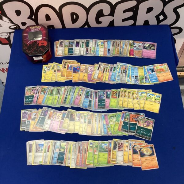 Pokemon cards in a Team Rocket tin for collectors.
