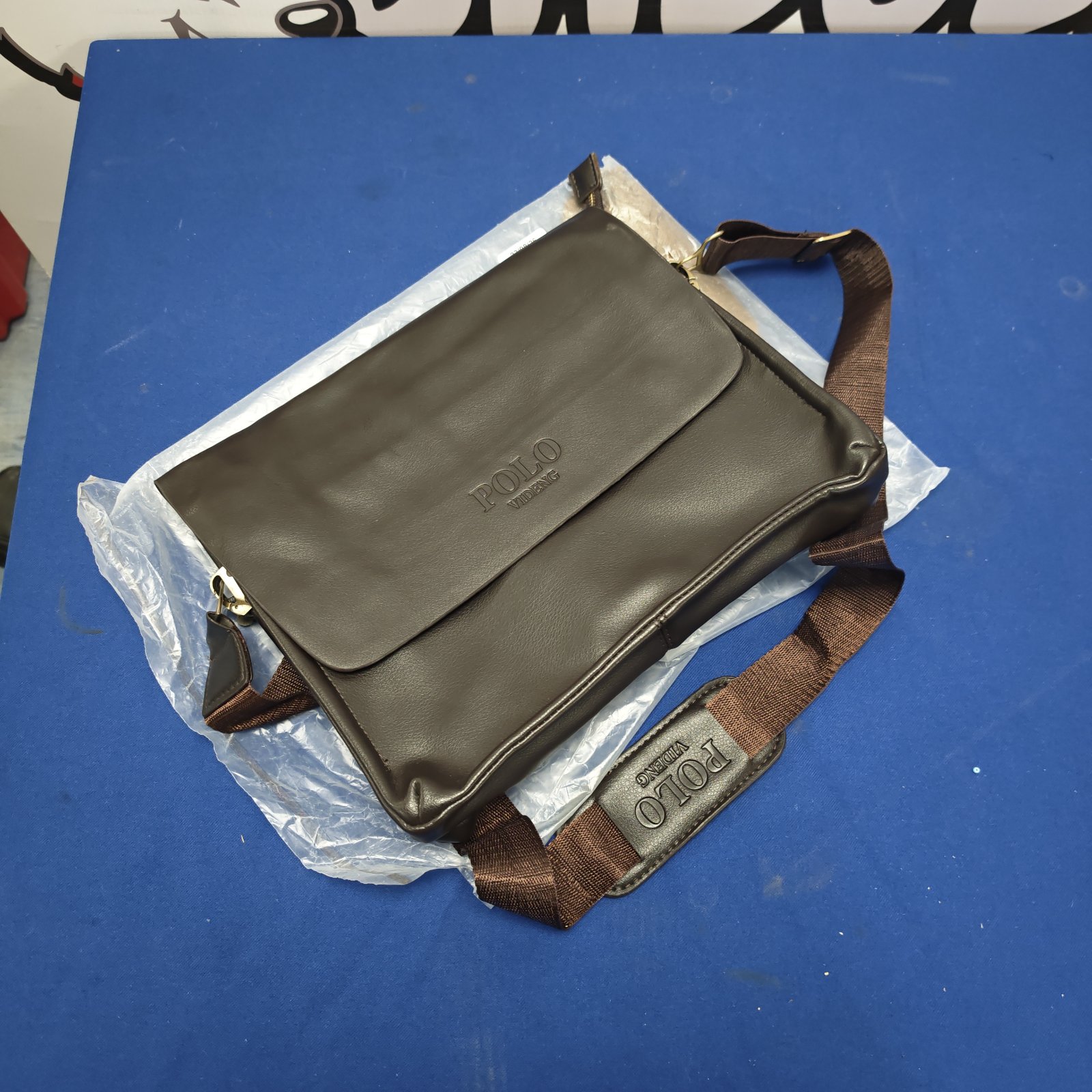 Unused Polo Videng brown leather shoulder bag with strap.