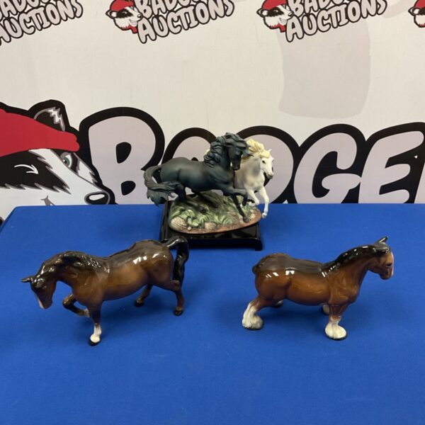 Group of three porcelain horse figurines including Beswick and Franklin Mint.