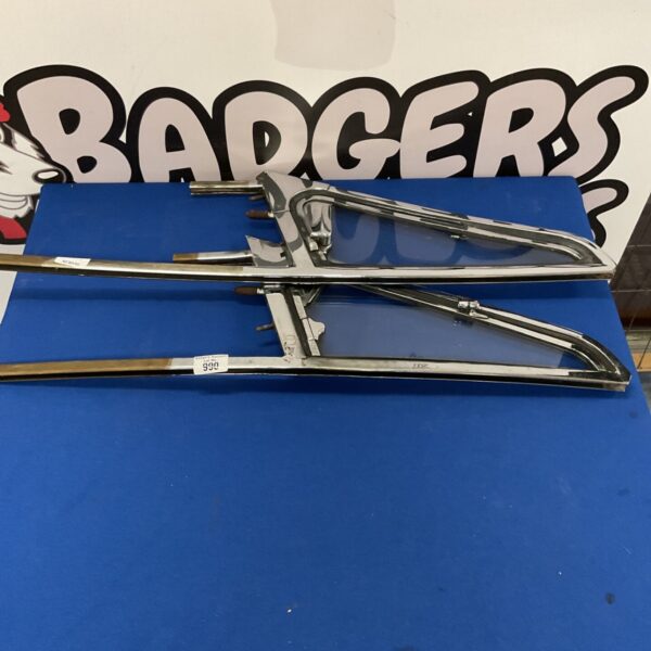 Vintage Porsche 911 window frames with chrome finish and opening vent.